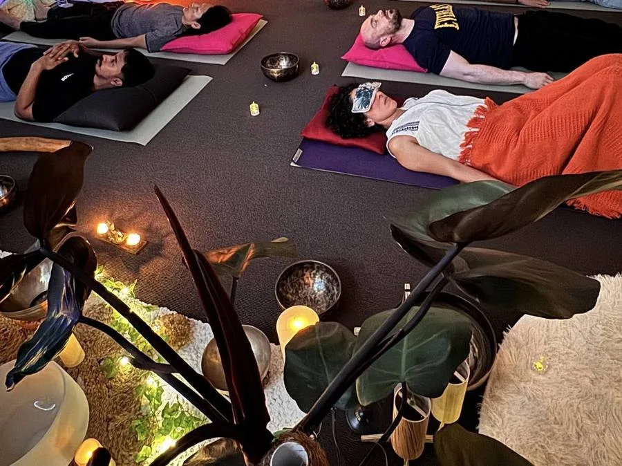 Community sound session with people resting at Mystic Wellness